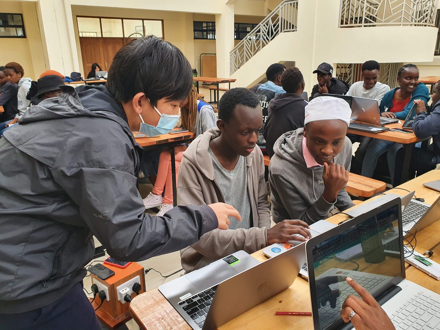Arthur working through code with a group of students